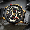 Luxury watch with black and gold design on a textured surface