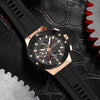 Luxury watch with black and rose gold design on a gear background