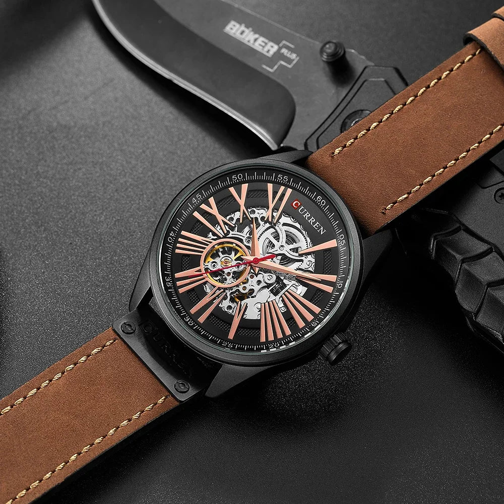 Watch with brown leather strap and visible brand name on a dark background