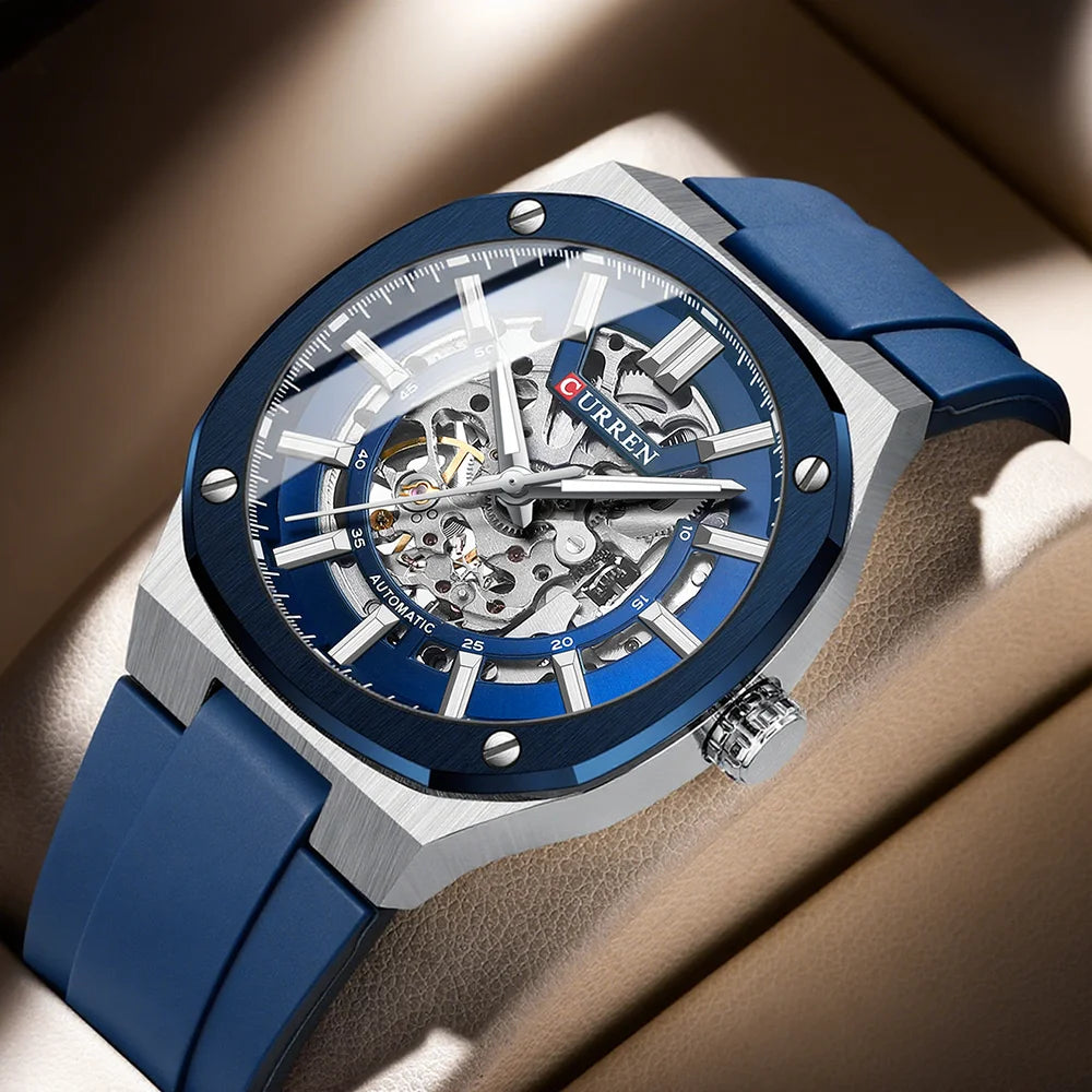 Blue and silver watch with visible brand name on a brown background