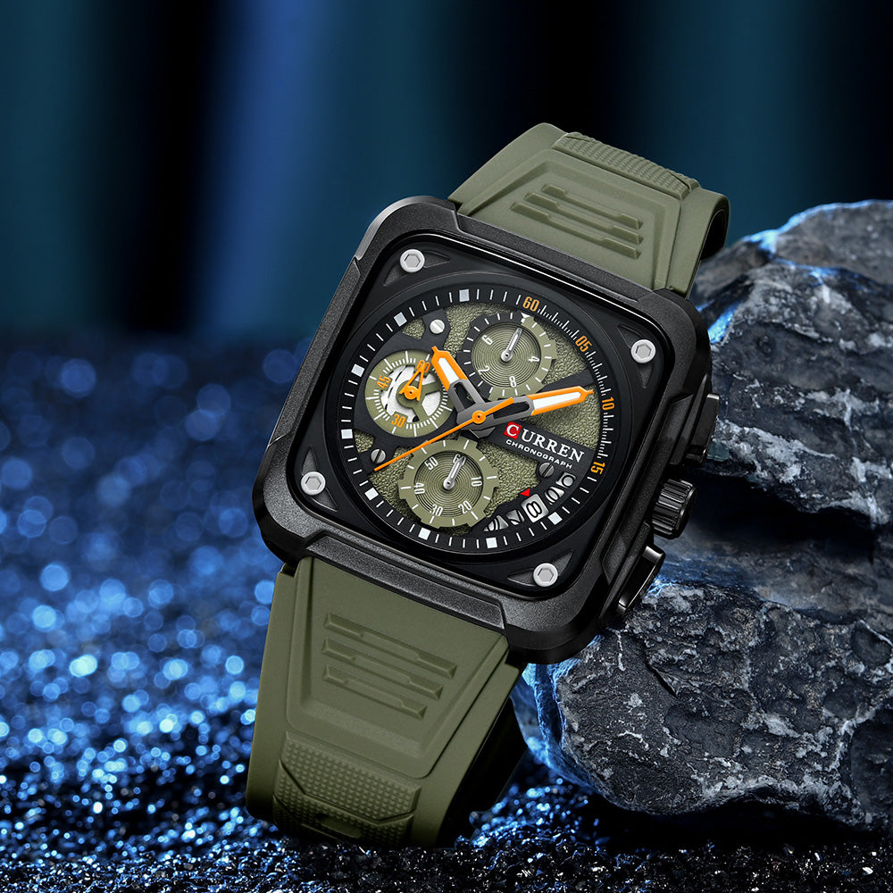 Green wristwatch with detailed face on a dark background